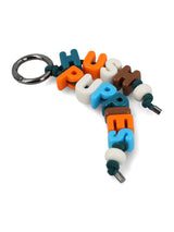 LLAVERO UNISEX KEYCHAIN LETTERS MULTI HUSH PUPPIES